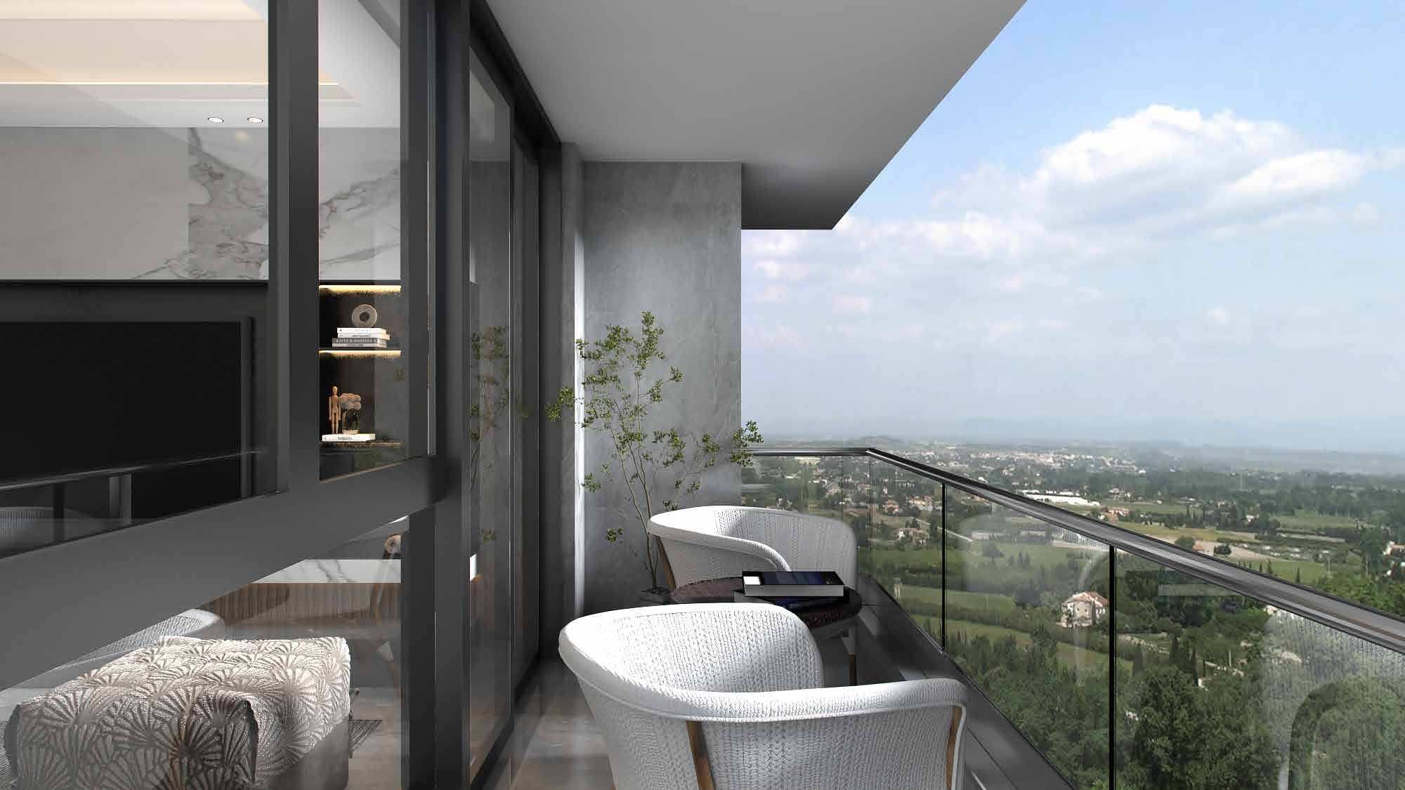 A glass-railed balcony with two armchairs, looking out over green treetops into the distance.