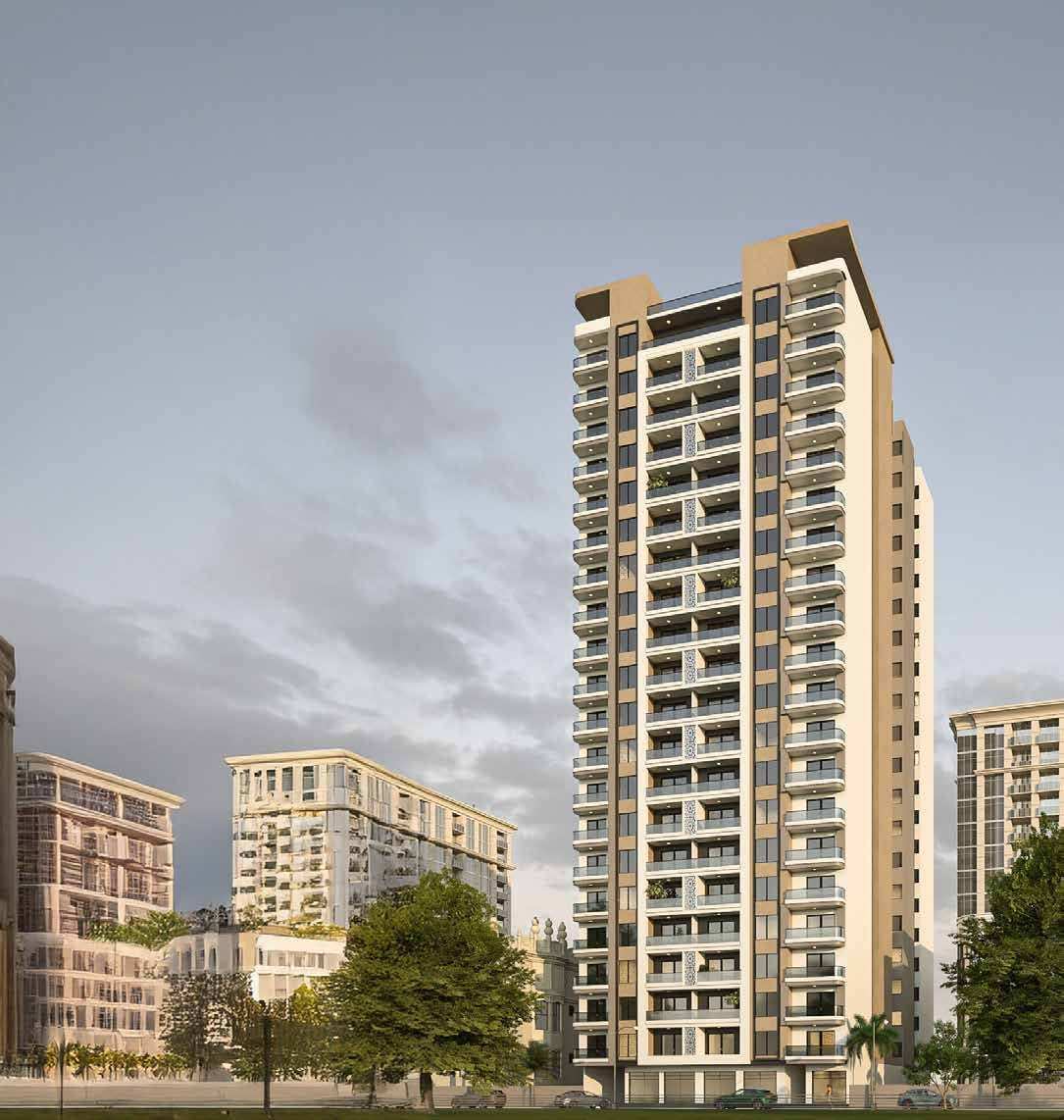 Ushirika Residence standing taller than the surrounding apartment blocks under a cloudy sky.