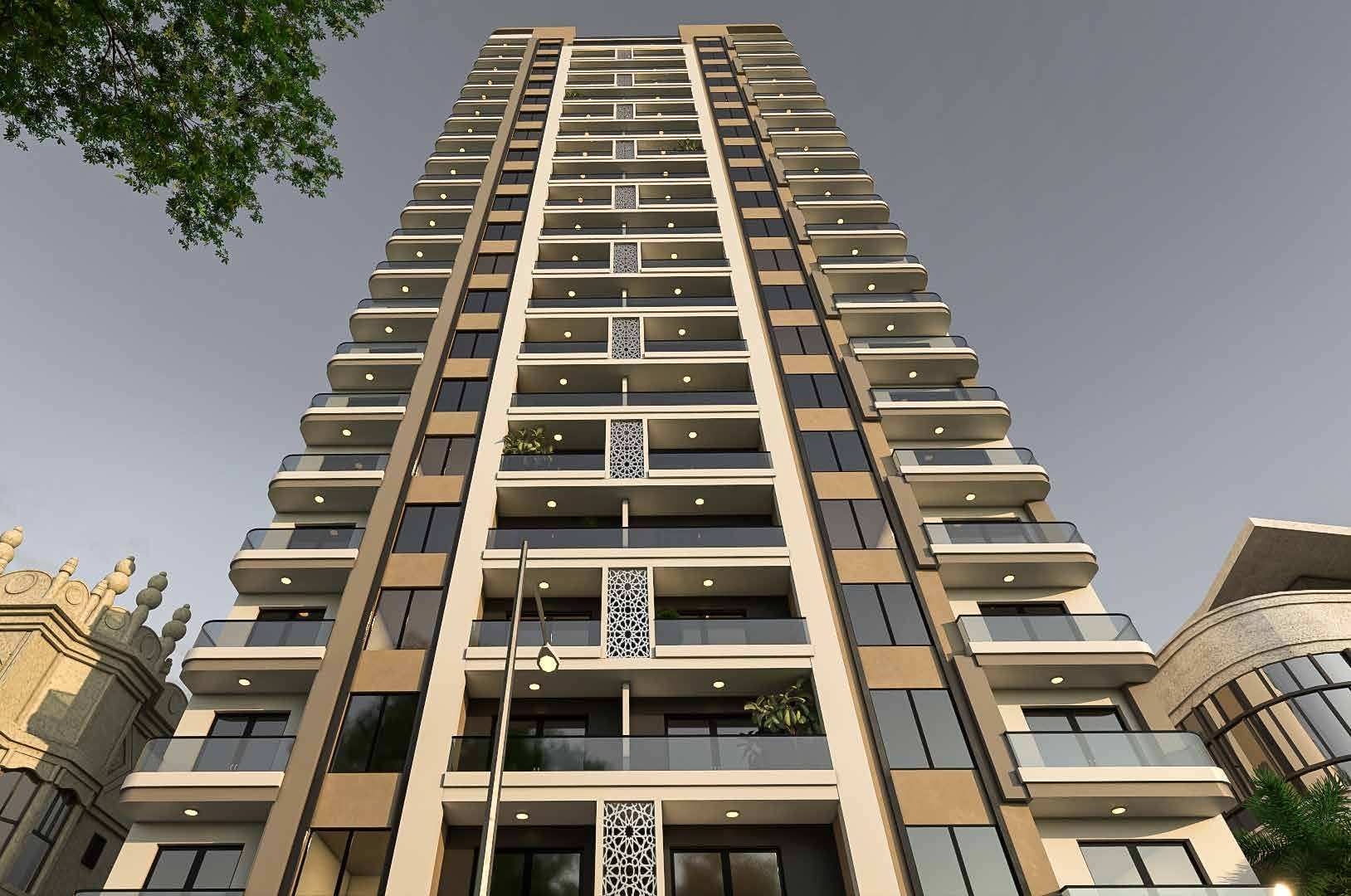 Looking up at the Ushirika Residence tower, its stacked bronze-edged balconies rising above the street.
