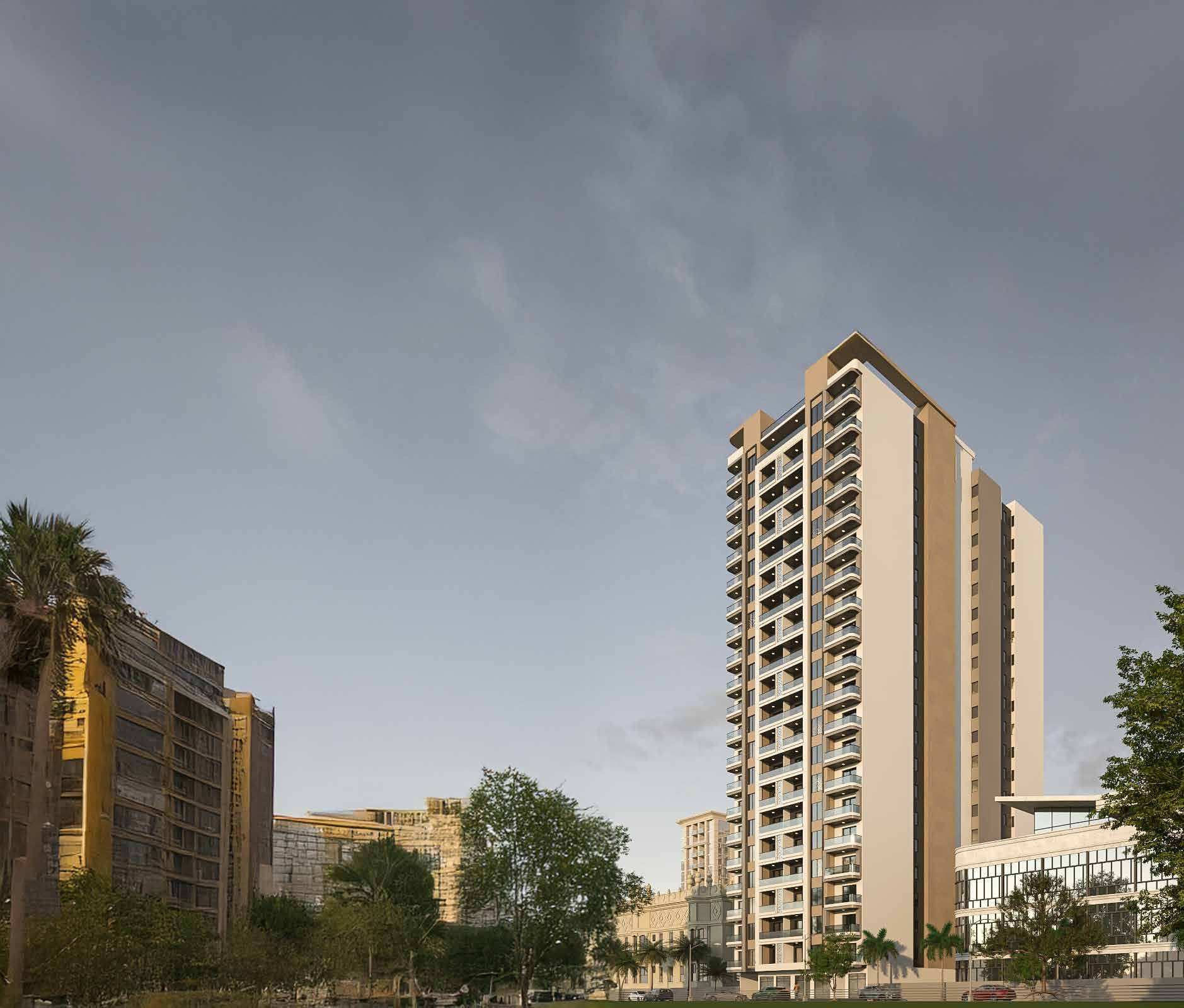 Ushirika Residence rising above palm trees and neighbouring buildings against a grey sky.